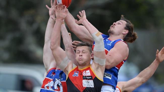 Dingley’s Danny Ades contests a mark with St Pauls players including Matthew Kreymborg (Right) Picture: Chris Eastman