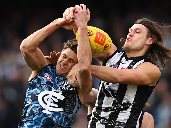 Charlie Curnow and Darcy Moore, on Sunday, fought an epic battle on the MCG. Picture: Getty Images