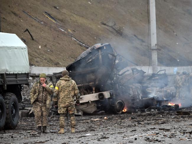 Ukrainian service members are seen at the site of a fighting with Russian raiding group in the Ukrainian capital of Kyiv. Picture: AFP