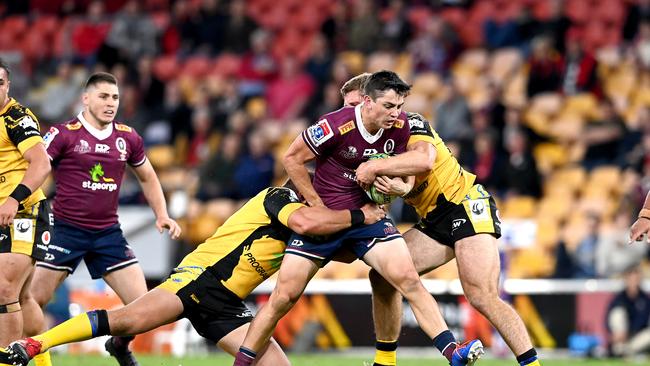 BRISBANE, AUSTRALIA - JULY 17: Jock Campbell of the Reds is tackled during the round three Super Rugby AU match between the Reds and Force at Suncorp Stadium on July 17, 2020 in Brisbane, Australia. (Photo by Bradley Kanaris/Getty Images)