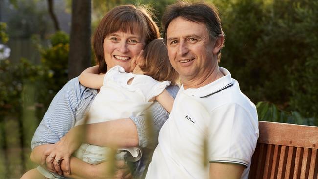 Kirsty and Chris with one of their foster daughters at their family home. Picture: Matt Loxton