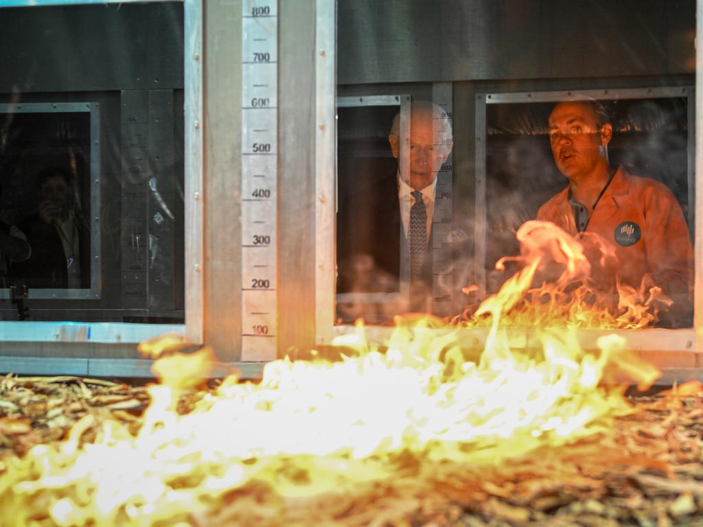 King Charles III listens to research scientist Dr. Matt Plucinski describe the "Pyrotron" combustion wind tunnel during a visit to the CSIRO National Bushfire Behaviour Research Laboratory on Monday. Picture: Getty Images