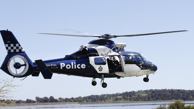 A police helicopter takes off for a search of the Sugarloaf Reservior area. Picture: David Caird