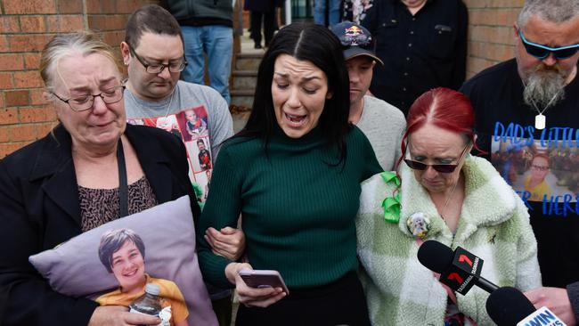 Mother of victim Zane Mellor, Georgie Burt, addresses the media alongside family outside the Devonport Magistrates Court. Picture: Brodie Weeding