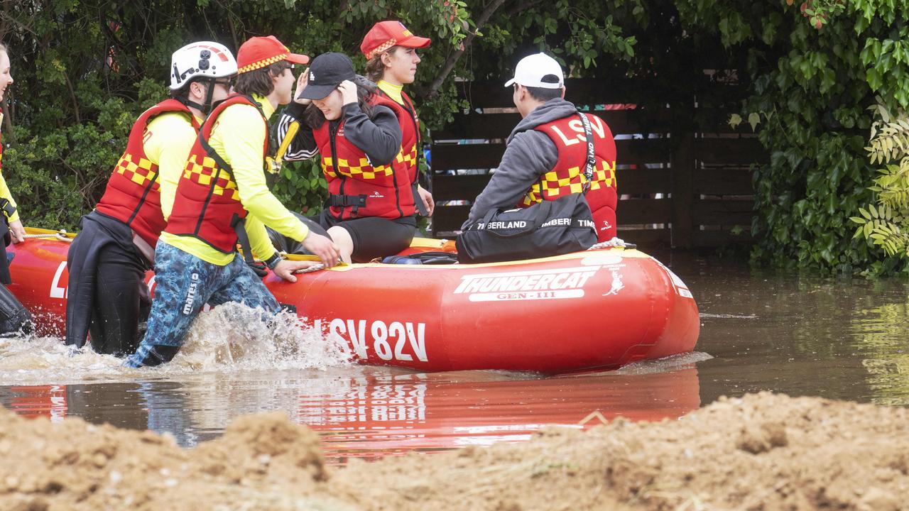 A couple are rescued from their house in Echuca. Picture: Rob Leeson.