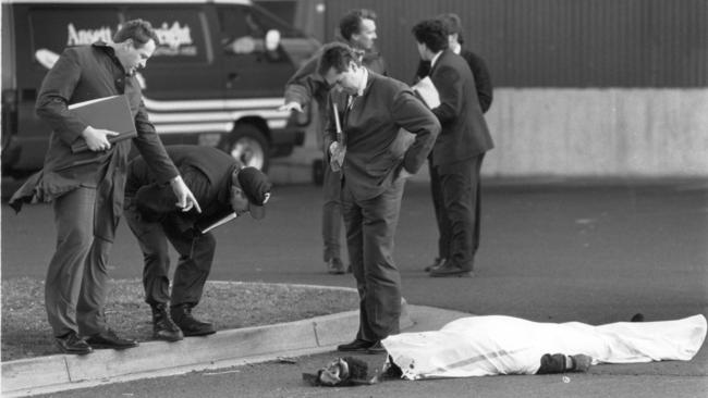 Normie Lee lies dead in the after a failed armed robbery of an armoured van at Melbourne Airport in 1992.