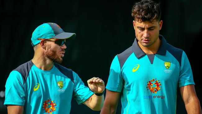 Australia’s David Warner and Marcus Stoinis take in training. Picture: AFP