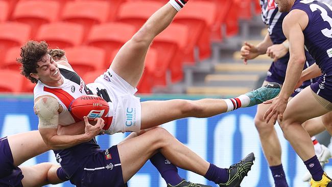 Nick Coffield is brought down in a heavy tackle by Sean Darcy. Picture: Michael Klein