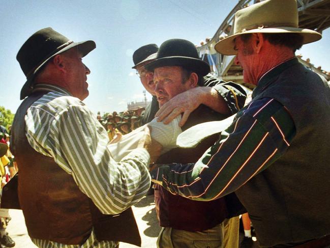 19 Oct 2001 - Re-enactment of the Warwick incident where Patrick Brosnan (played by his grandson) hurled /eggs at the Pime Minister Billy Hughes. Mr Brosnan is being restrained by other citizens. picDavid/Martinelli,  play history event actors