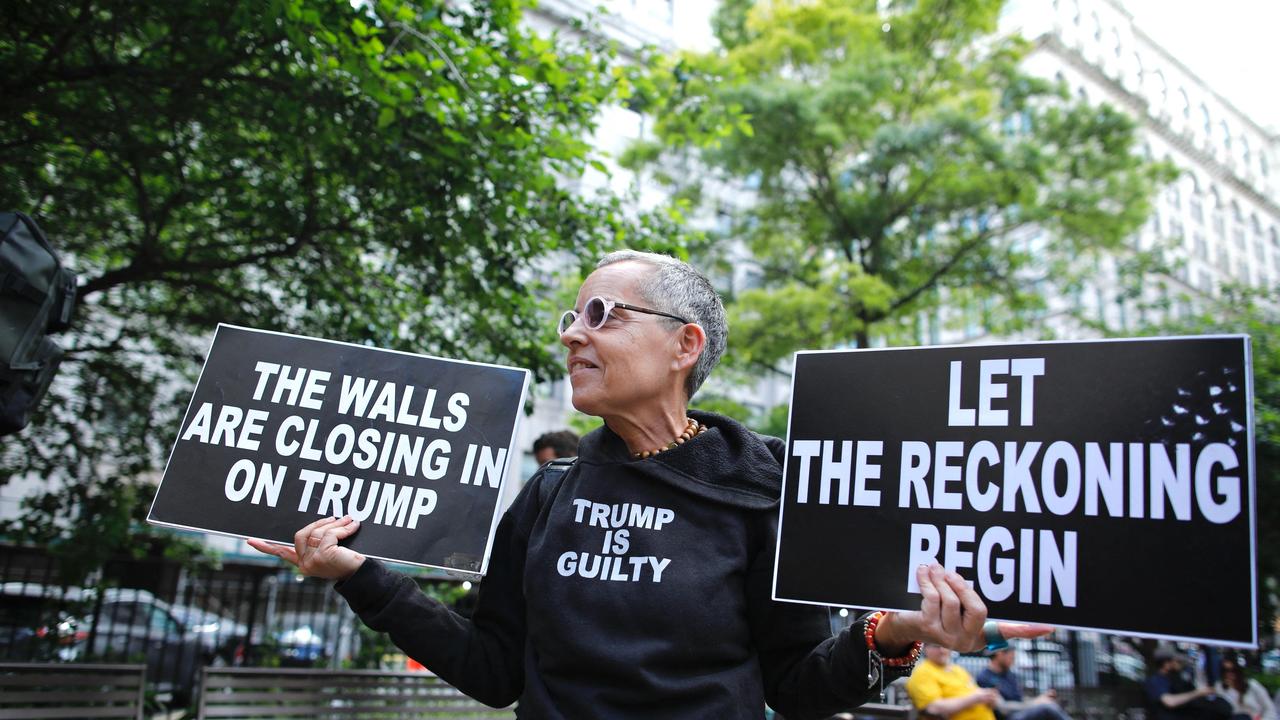 Hundreds of Trump supporters and protesters gathered outside the court.