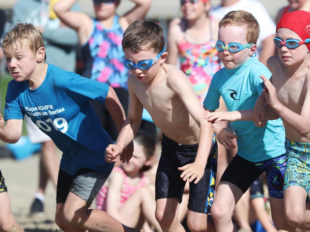 Participants competing in the Bupa KidFit Series triathlon at Blackmans Bay Beach. Picture: LUKE BOWDEN