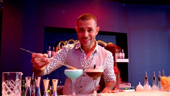 Mixologist Denis Gambino pictured with cocktails at the D. L. M pop up bar Barangaroo. Picture: Damian Shaw