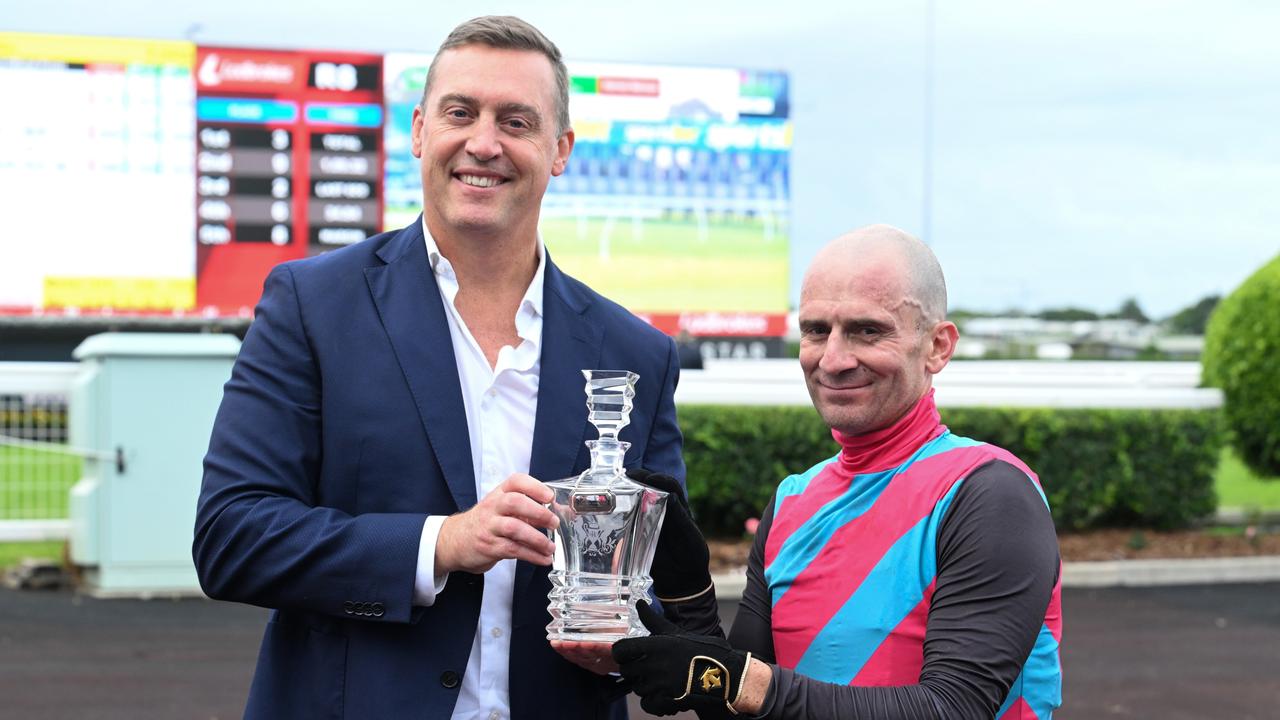 Vlad Duric with trainer Tony Gollan after Antino won the Victory Stakes at Eagle Farm during the Queensland winter carnival. Picture: Grant Peters/Trackside Photography