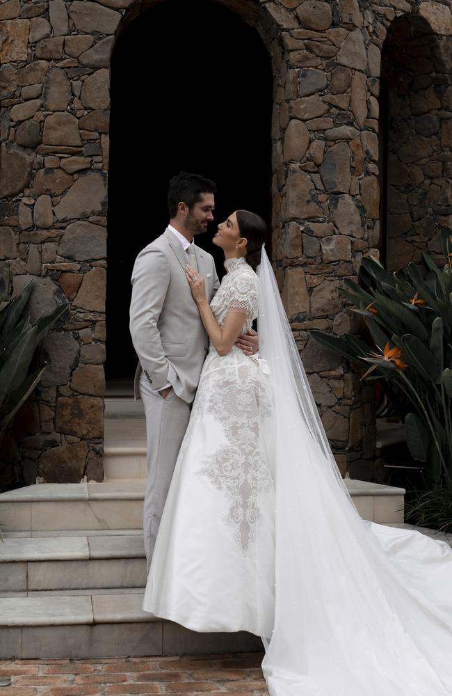 Erin Holland with husband Ben Cutting in her wedding gown.