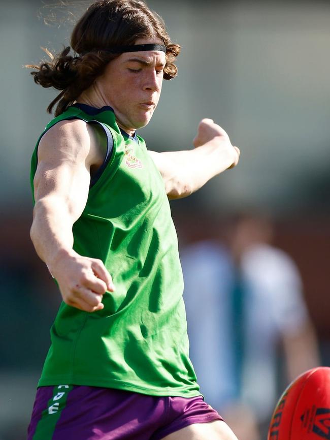 Noah Scott takes a kick for Parade.