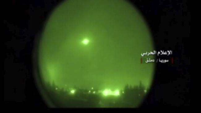 This frame grab from video provided by the government-controlled Syrian Central Military Media, shows missile flying over the capital Damascus during airstrikes by the United States, France and Britain.