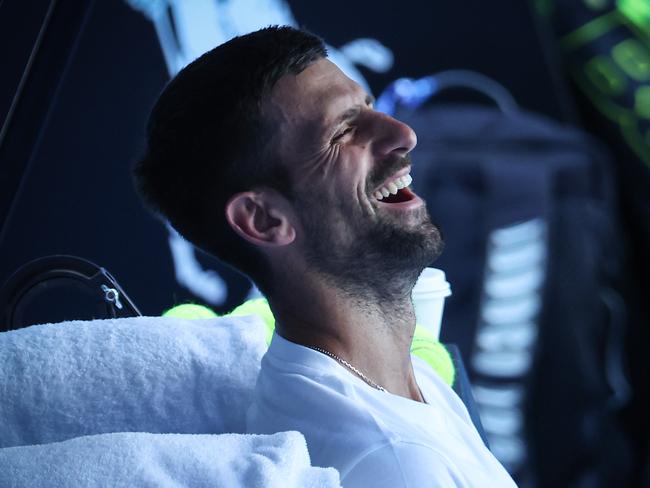 Djokovic laughs during a practice session at Melbourne Park. Picture: David Caird