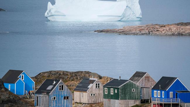 Icebergs float behind the town of Kulusuk in Greenland. (Photo by Jonathan NACKSTRAND / AFP)