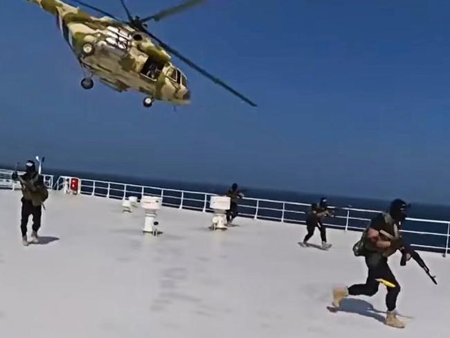 Yemen's Houthis rebels have released a video showing armed men seizing a cargo ship in the southern Red Sea., , The video from Yemeni Military Media shows at least seven masked men, carrying what appears to be AK-47s, drop from a helicopter and land on the top deck of the ship., The ship was hijacked on Sunday by the Iran-backed group, who said the ship was linked to Israel. Israel claimed that the seized ship was instead British-owned and Japanese-operated.