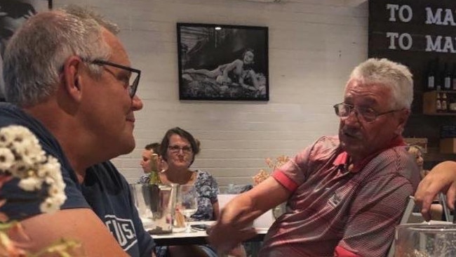 Images posted on PM Scott Morrison chats to locals. 