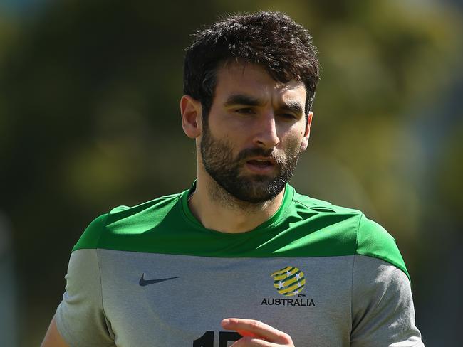 MELBOURNE, AUSTRALIA - JANUARY 03: Mile Jedinak of Australia runs laps during an Australian Socceroos training session at the Collingwood Training Ground on January 3, 2015 in Melbourne, Australia. (Photo by Robert Cianflone/Getty Images)