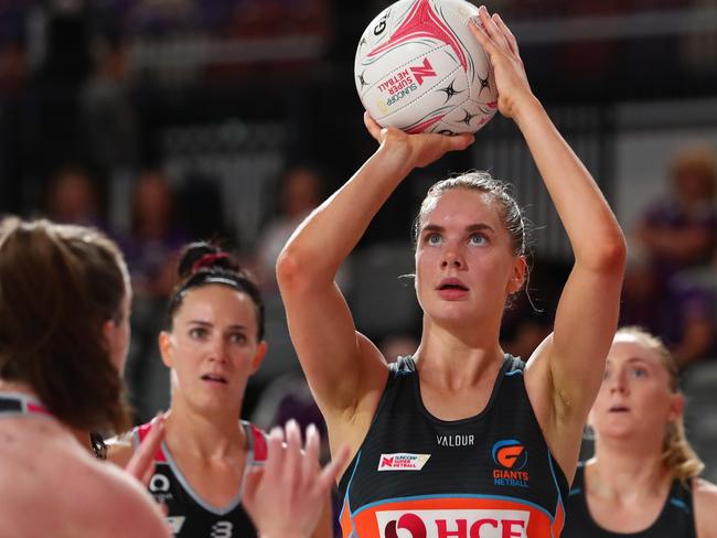 BRISBANE, AUSTRALIA - AUGUST 08: Kiera Austin of the Giants shoots during the round two Super Netball match between the Giants and the Adelaide Thunderbirds at Nissan Arena on August 08, 2020 in Brisbane, Australia. (Photo by Chris Hyde/Getty Images)