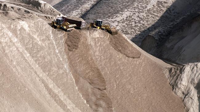 Diggers take on the mountain of a task to level this peak.