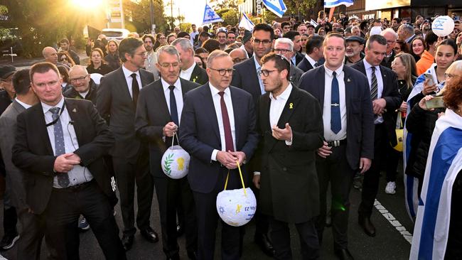 Anthony Albanese walks with members of the Melbourne Jewish community during a vigil on Monday. Picture: AFP