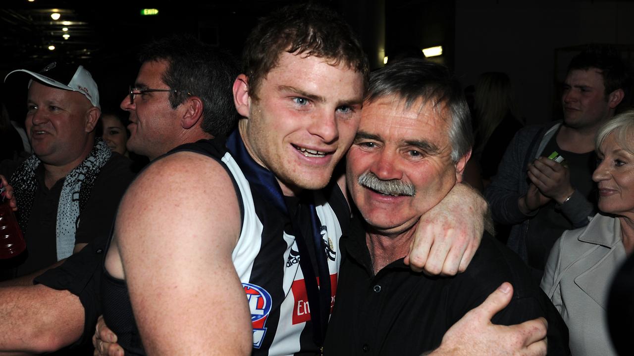 Heath Shaw hugs father Ray after the 2010 Grand Final. Photo: Colleen Petch.