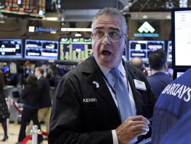 Trader Kenneth Polcari works on the floor of the New York Stock Exchange, Tuesday, Nov. 24, 2015. Stocks are opening modestly lower, following declines in Europe. (AP Photo/Richard Drew)