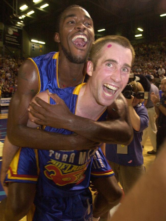 Star men Willie Farley and skipper Brett Maher embrace following Adelaide 36ers’ 2002 championship triumph. Picture: Chris Crerar