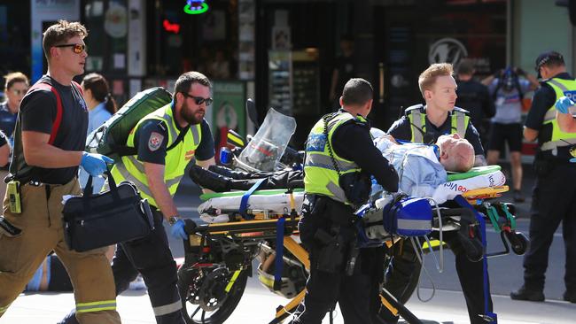 21/12/17 Police, Fire and Paramedics treat a number of pedestrians on the corner of Flinders Street and Elizabeth Street in Melbourne after a car is believed to have ploughed through a busy intersection. Aaron Francis/The Australian