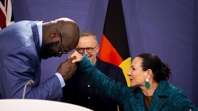 A curious exchange between Shaquille O’Neal and the Minister for indigenous Australians Linda Burney, as he reaches her hand to touch his forehead. Picture: NCA NewsWire / Monique Harmer