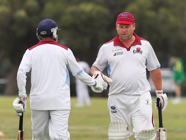 Celebrations were subdued from Newcomb's Praveen Mayavel and Jason Clark as they secured the win. Picture: Alan Barber