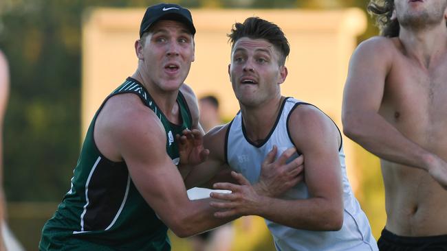 Tom Bell jostles with Ben Fennell at Greensborough training. Picture: Nathan McNeill