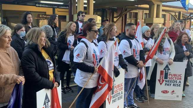 Protesters gather at Wollongong station Wednesday to head to the Sydney protest. Picture: Public Service Association of NSW.