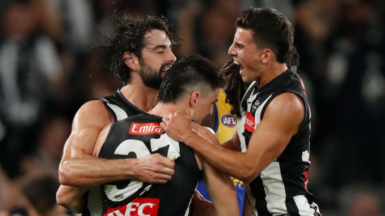 MELBOURNE, AUSTRALIA - APRIL 09: (L-R) Brodie Grundy, Brayden Maynard and Nick Daicos of the Magpies celebrate during the 2022 AFL Round 04 match between the Collingwood Magpies and the West Coast Eagles at Marvel Stadium on April 09, 2022 In Melbourne, Australia. (Photo by Michael Willson/AFL Photos via Getty Images)