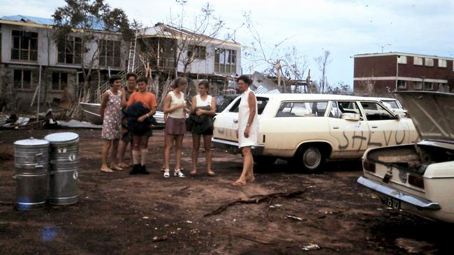 The point of operations after the cyclone. Pictured behind is what remained of Ruth and Graham White's hostel, which would later house the Morris family through 1975. Depicted are Helen White, Carol Brown, Duncan Morris, Winsome Merrett, Valerie Barker, and Wilga Morris. Picture: Supplied