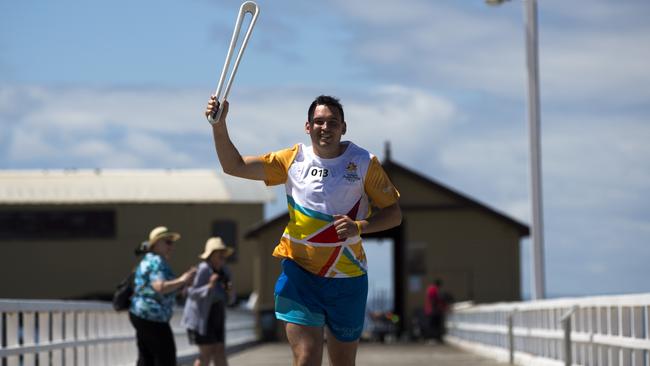 Batonbearer Tom Limb carrying the Baton as the Queen's Baton Relay visited Queenscliff.