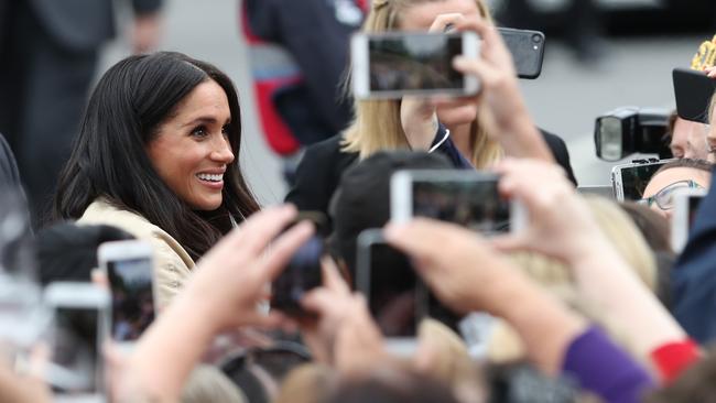 The crowds try to snap a picture Duchess of Sussex. Picture: AAP