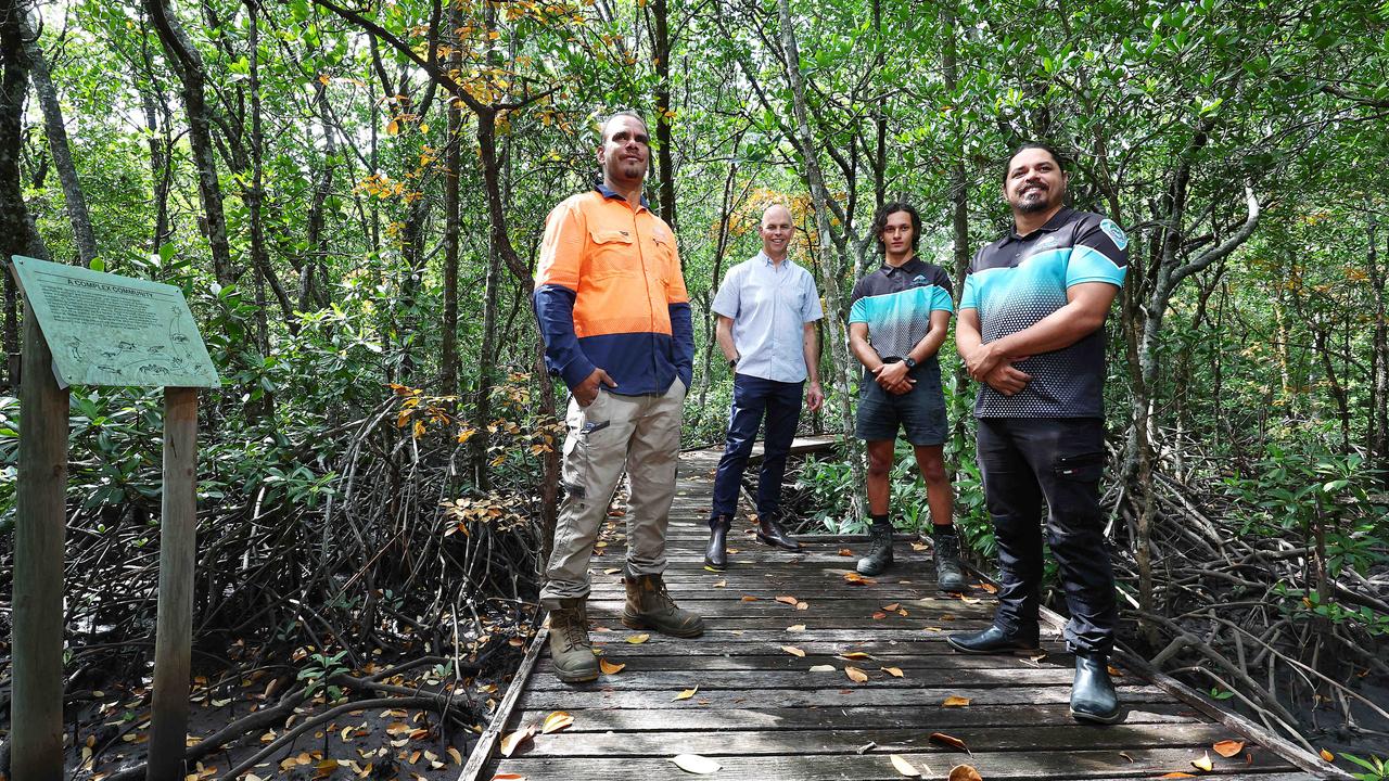 In 2022 the Jack Barnes bicentennial mangrove boardwalk reopened after the Cairns Airport took control of the facility from council and restored the decking and support columns. Warren Singleton, who worked on the boardwalk restoration, with Cairns Airport CEO Richard Barker and Lachlan Mitchell and Gavin Singleton from the Yirrganydji land and sea rangers on the boardwalk among the mangroves. Picture: Brendan Radke