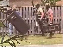 Screenshots of a video taken by a Pimpama resident showing police in her street.