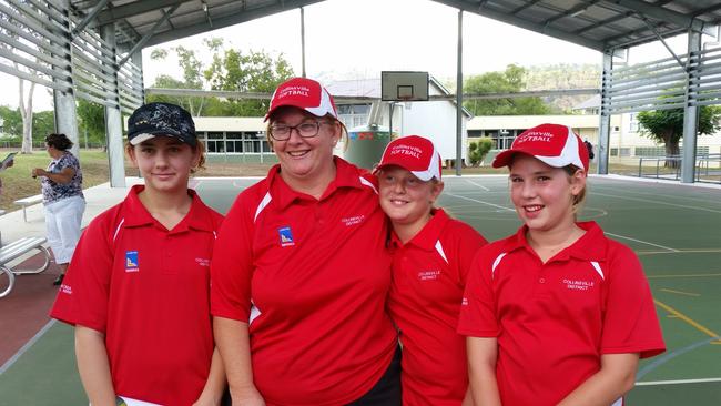 Softball coach Ann-Marie Williamson (second from left) with players (from left) Clare Williamson, Skyra Goody and Madison Fisher in 2015.
