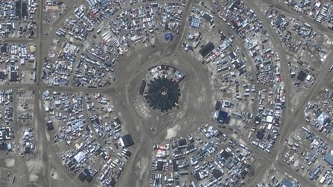 This handout satellite image courtesy of Maxar Technology shows an overview of the centre camp of Burning Man festival on September 4, 2023. (Photo by Satellite image Maxar Technologies / AFP)