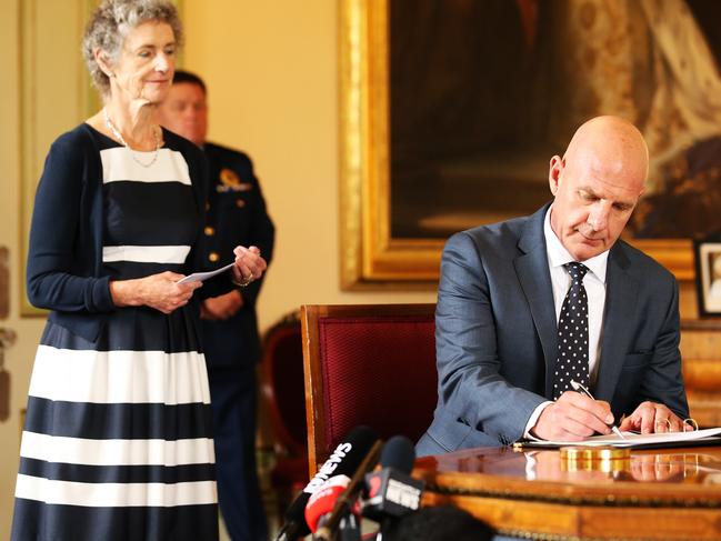 New Tasmanian Premier Peter Gutwein alongside Tasmanian Governor Kate Warner as he is sworn in at Government House this week. Picture: ZAK SIMMONDS