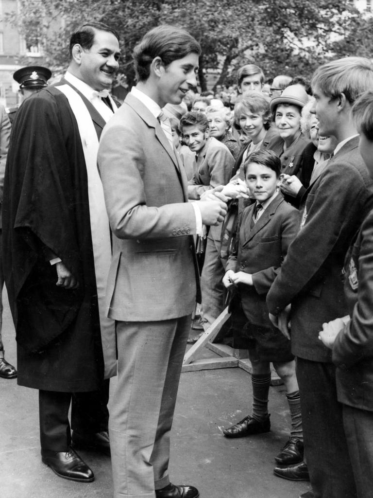 APRIL 1, 1970 : Charles, Prince of Wales is accompanied by Lord Mayor Nick Shehadie as he chats with schoolboys in George Street in Sydney, 01/04/70 during his Australian tour. Picture News Limited.