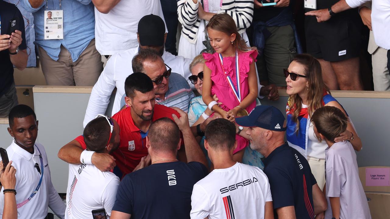 Djokovic celebrates with his team and family. (Photo by Matthew Stockman/Getty Images)