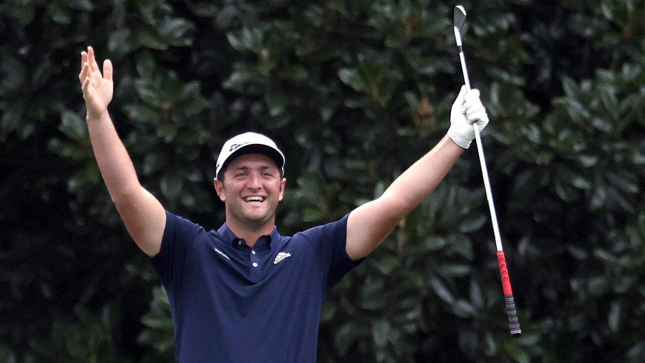 Jon Rahm celebrates skipping in for a hole in one on the 16th during a practice round. Rob Carr/Getty Images/AFP