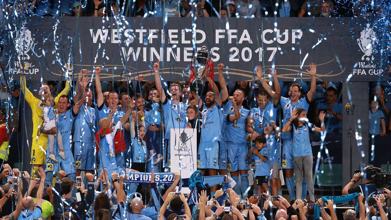Sydney players celebrate victory during the presentation ceremony after the FFA Cup Final