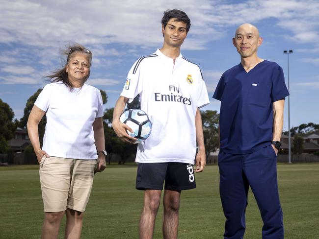 Teenager Nathan Fernandes , Mum Queen FernandoÃs and Dr  Nelson Low.  Nathan Fernandes collapsed in pain and spent the next 18 months housebound, barely able to walk and certainly not able to play soccer - he was a champion athlete.Mum Queenie took him to multiple doctors and specialists but no one could tell Nathan what was wrong and what was causing his excruciating calf pain. Queenie turned detective and worked in collaboration with Monash Children's Health Head of Paediatric Plastic Surgery Dr Nelson Low to discover that Nathan, now 16 and in Year 11, had a rare conditio n where the tibial nerve was compressed in his calf. Picture by Wayne Taylor 22nd February 2024